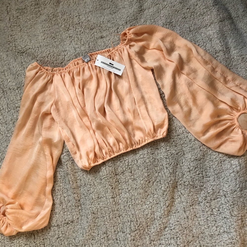 Sheer orange blouse with bubble sleeves